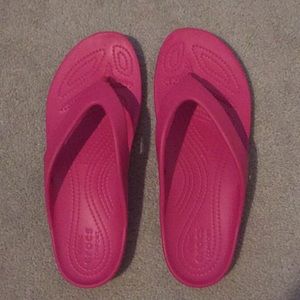 Crocs pink flip flops